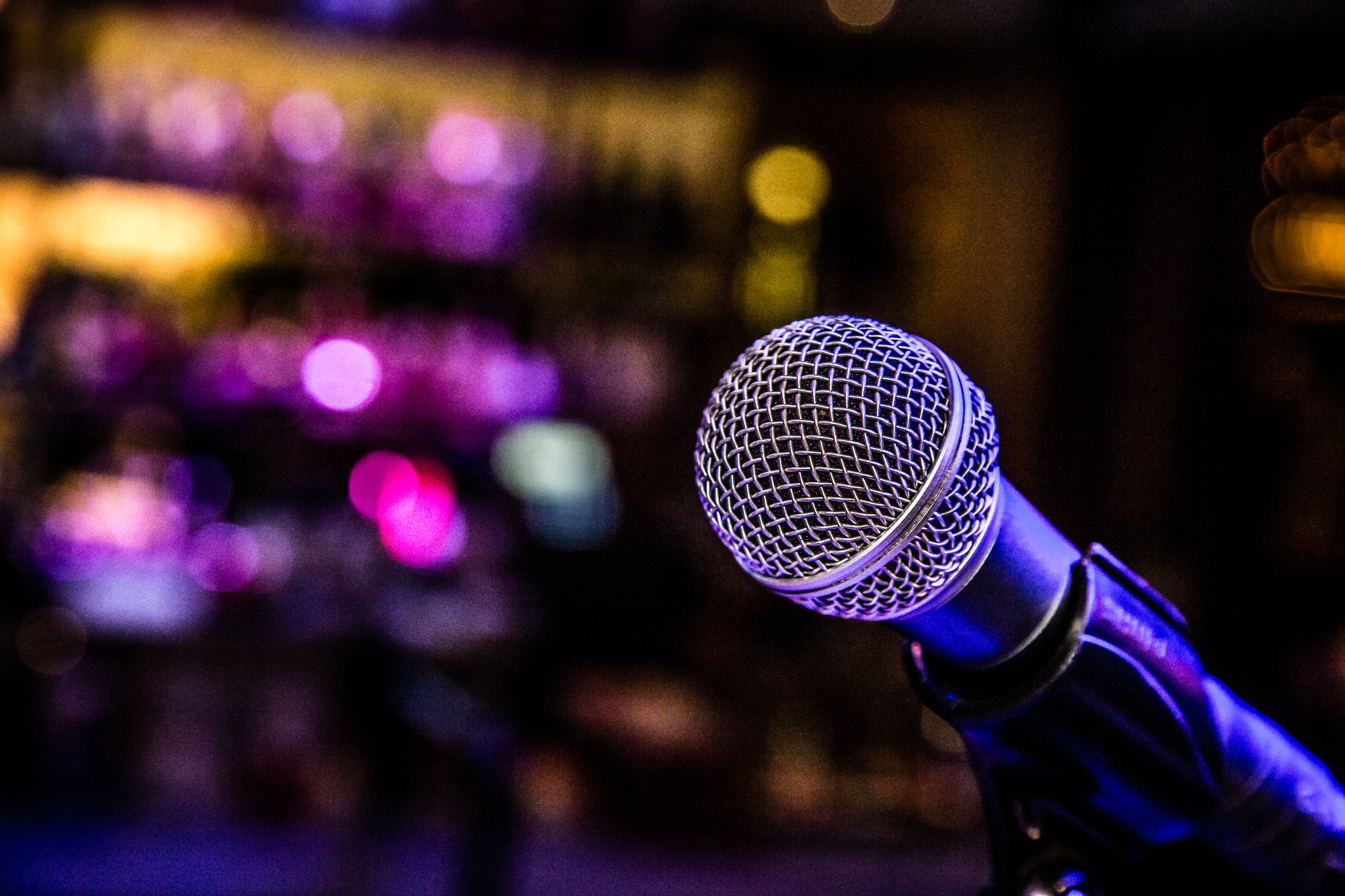 Comedy or Music Show at Night with Microphone and Blue Lights Nightlife